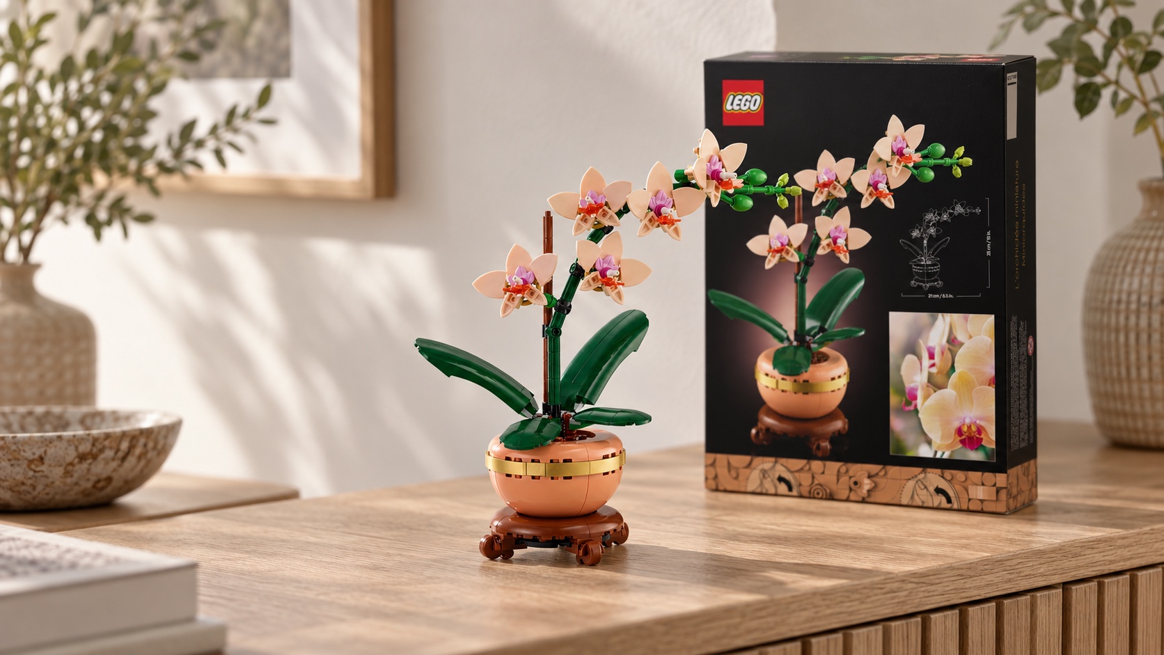 Illustrative scene showing a LEGO Mini Orchid build beside its box on a wooden console